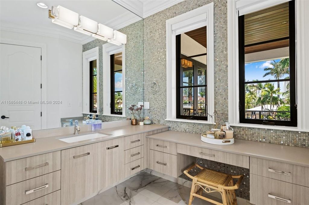 Located in the prestigious gated community of Golden Isles, this exquisite waterfront home at 631 Hibiscus Dr, Hallandale Beach, boasts six bedrooms and seven and a half opulent bathrooms within its 5,829 square feet of refined living space