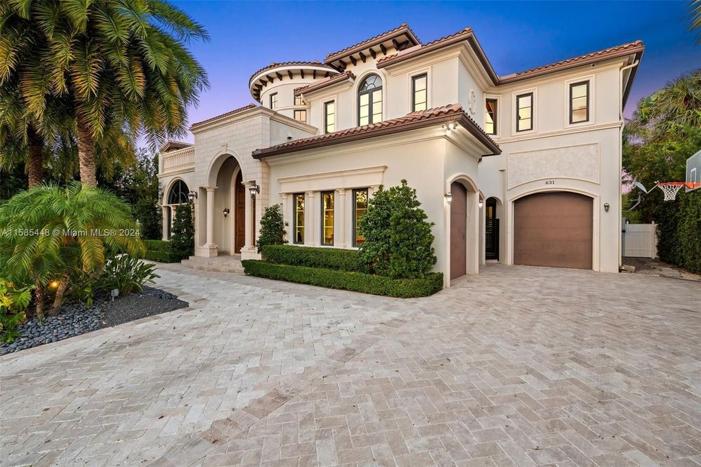 Located in the prestigious gated community of Golden Isles, this exquisite waterfront home at 631 Hibiscus Dr, Hallandale Beach, boasts six bedrooms and seven and a half opulent bathrooms within its 5,829 square feet of refined living space