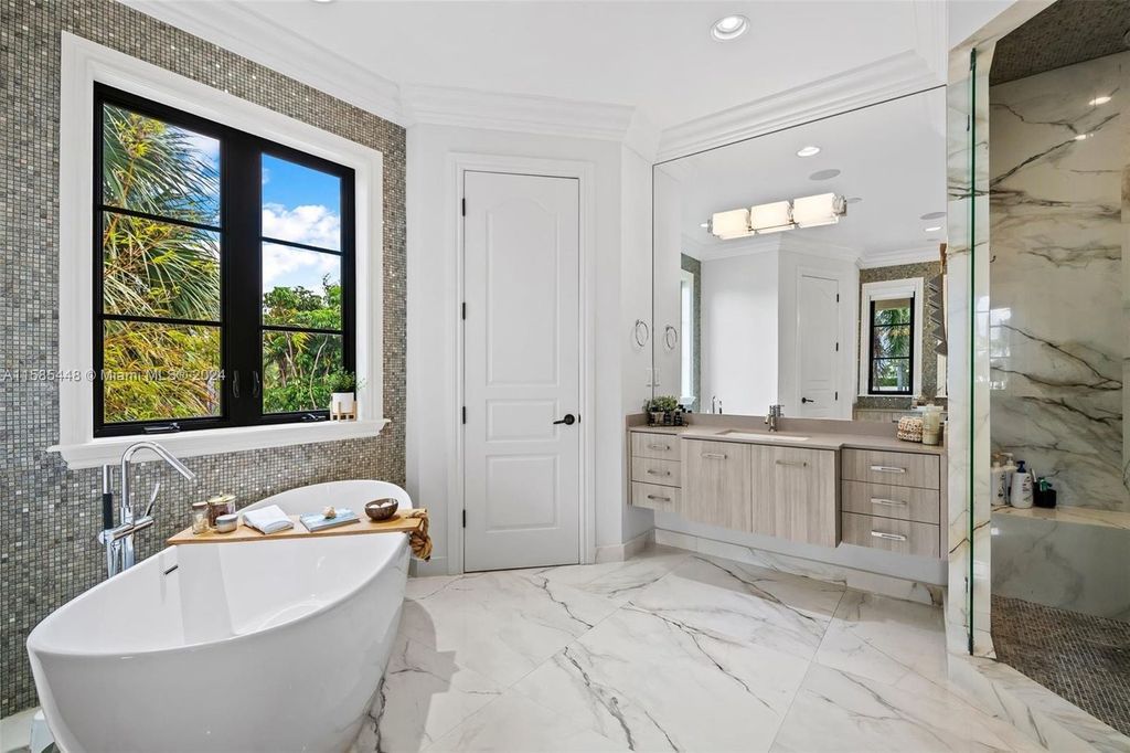 Located in the prestigious gated community of Golden Isles, this exquisite waterfront home at 631 Hibiscus Dr, Hallandale Beach, boasts six bedrooms and seven and a half opulent bathrooms within its 5,829 square feet of refined living space