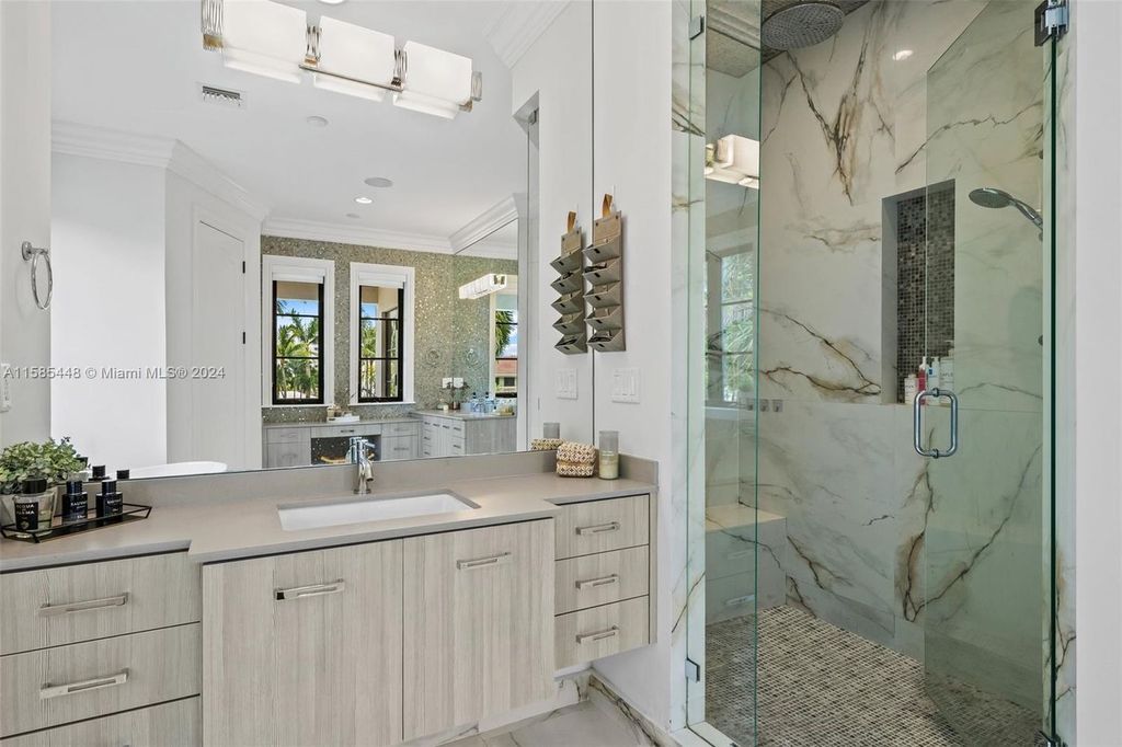 Located in the prestigious gated community of Golden Isles, this exquisite waterfront home at 631 Hibiscus Dr, Hallandale Beach, boasts six bedrooms and seven and a half opulent bathrooms within its 5,829 square feet of refined living space