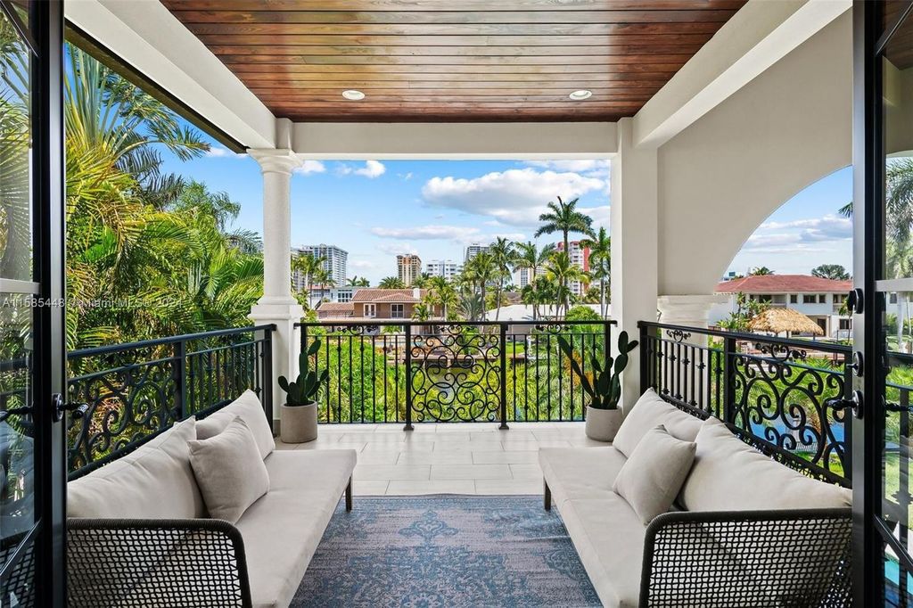 Located in the prestigious gated community of Golden Isles, this exquisite waterfront home at 631 Hibiscus Dr, Hallandale Beach, boasts six bedrooms and seven and a half opulent bathrooms within its 5,829 square feet of refined living space