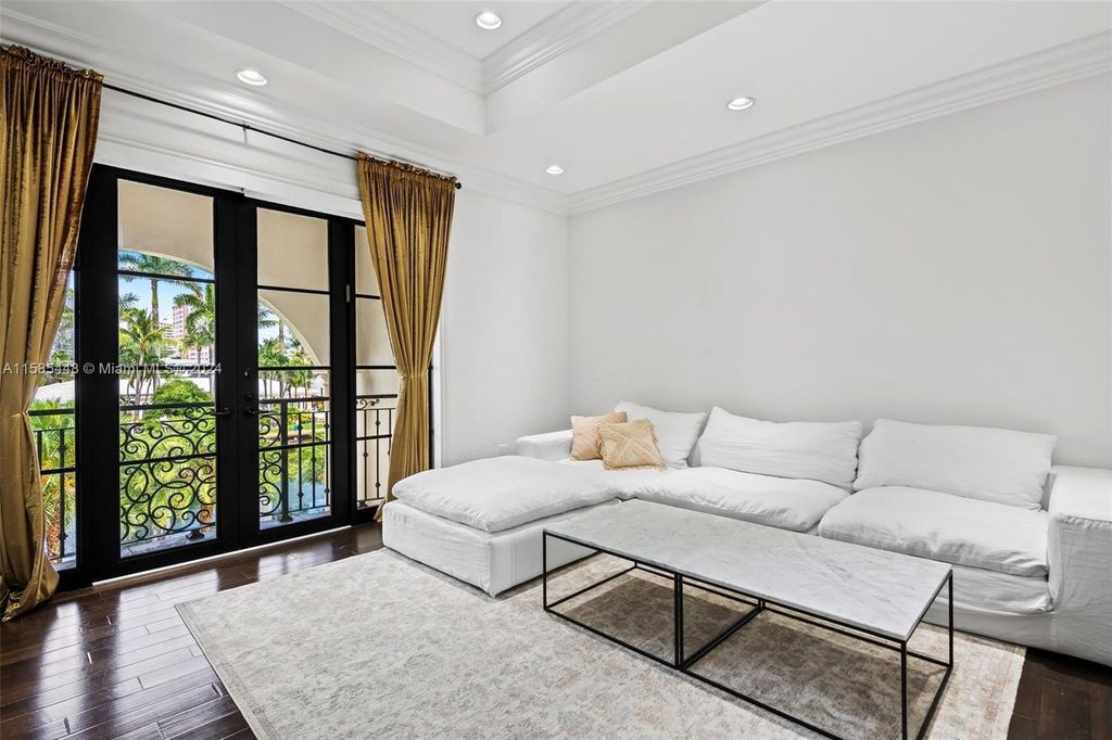 Located in the prestigious gated community of Golden Isles, this exquisite waterfront home at 631 Hibiscus Dr, Hallandale Beach, boasts six bedrooms and seven and a half opulent bathrooms within its 5,829 square feet of refined living space