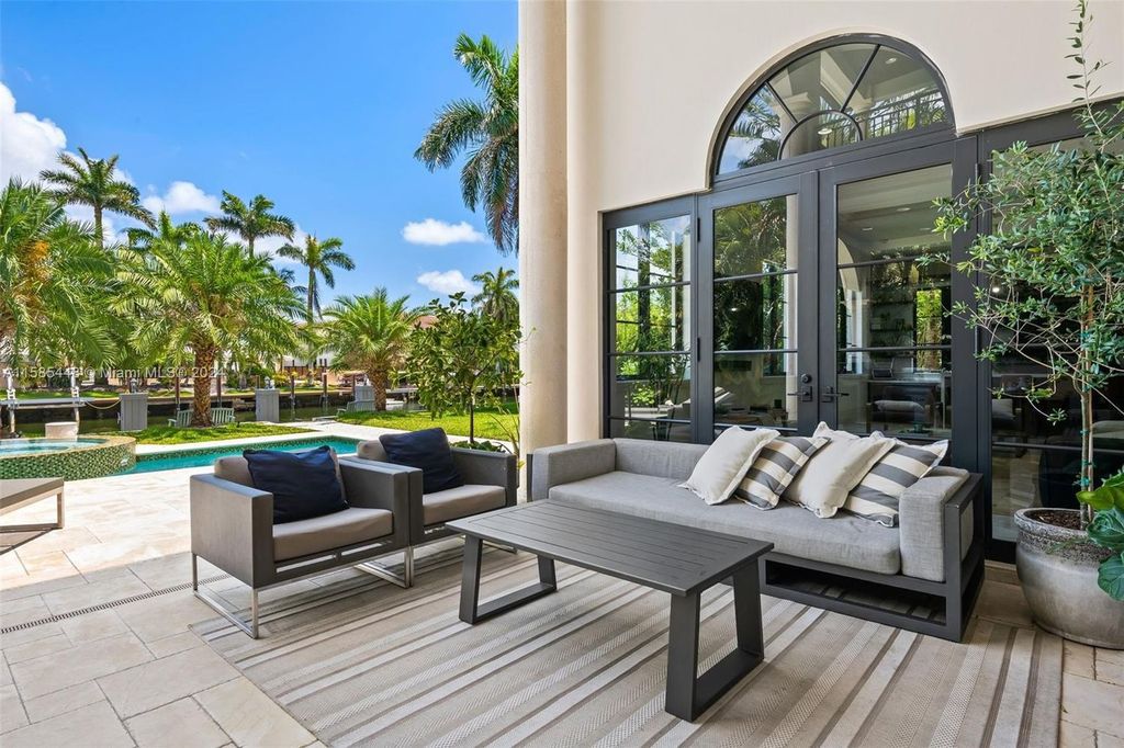 Located in the prestigious gated community of Golden Isles, this exquisite waterfront home at 631 Hibiscus Dr, Hallandale Beach, boasts six bedrooms and seven and a half opulent bathrooms within its 5,829 square feet of refined living space