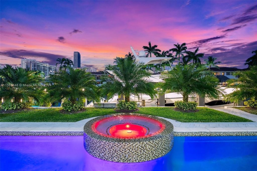 Located in the prestigious gated community of Golden Isles, this exquisite waterfront home at 631 Hibiscus Dr, Hallandale Beach, boasts six bedrooms and seven and a half opulent bathrooms within its 5,829 square feet of refined living space