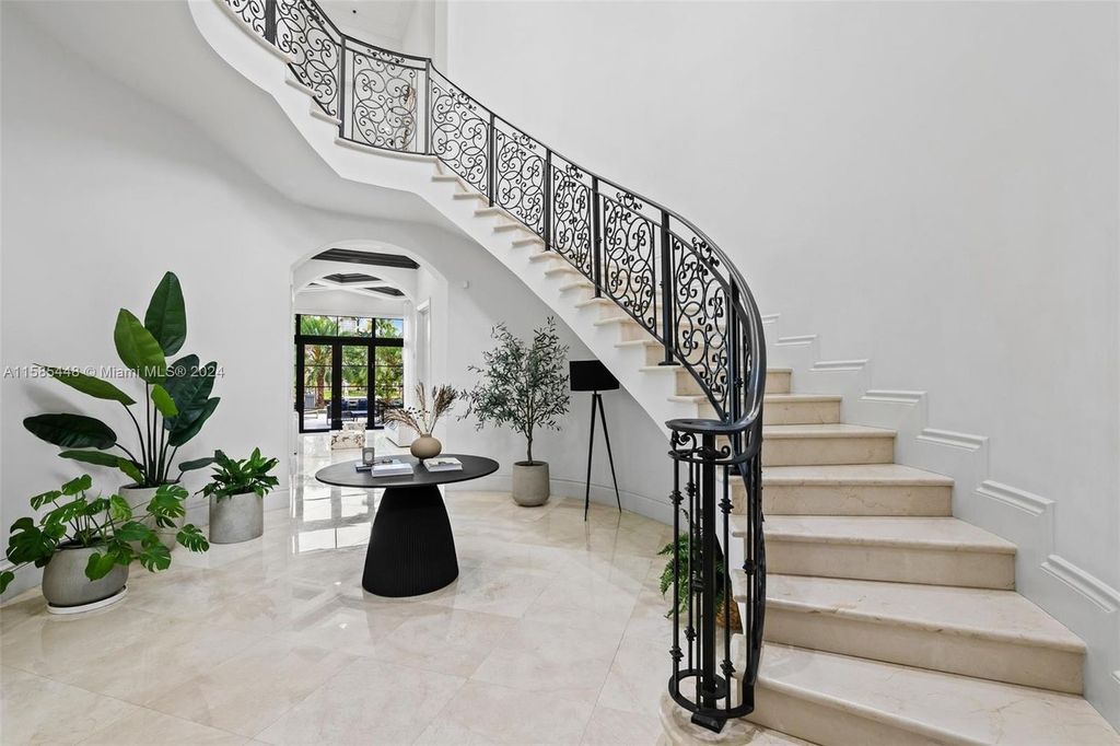 Located in the prestigious gated community of Golden Isles, this exquisite waterfront home at 631 Hibiscus Dr, Hallandale Beach, boasts six bedrooms and seven and a half opulent bathrooms within its 5,829 square feet of refined living space