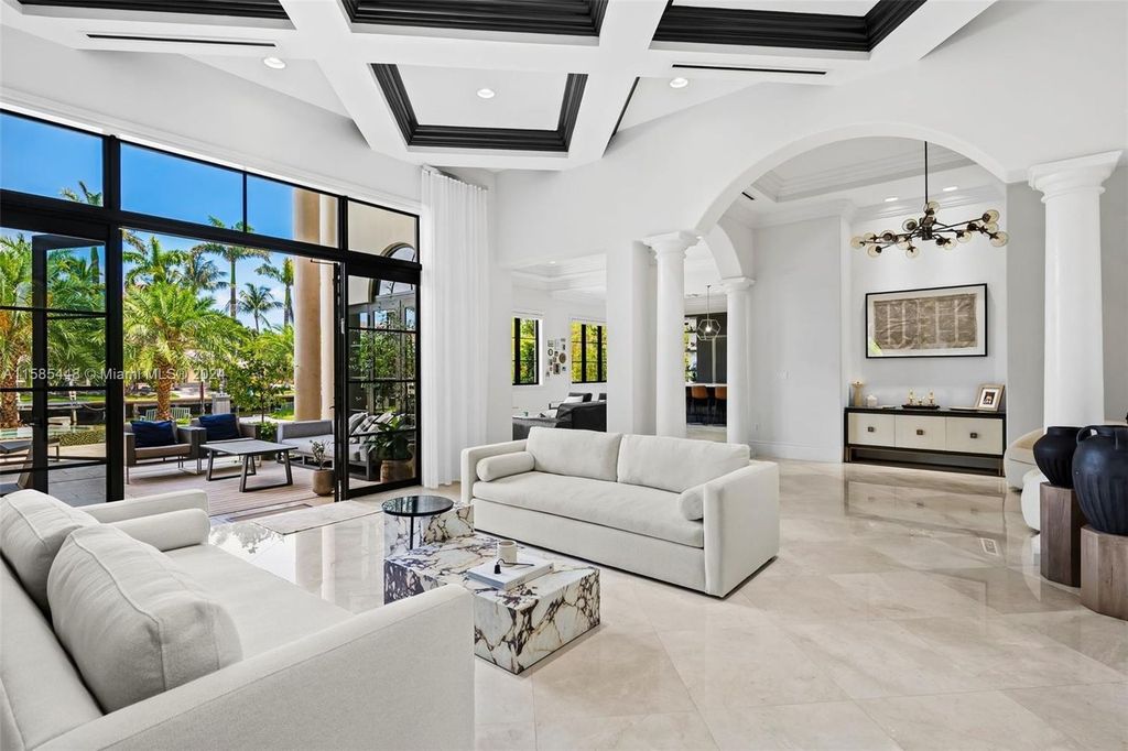 Located in the prestigious gated community of Golden Isles, this exquisite waterfront home at 631 Hibiscus Dr, Hallandale Beach, boasts six bedrooms and seven and a half opulent bathrooms within its 5,829 square feet of refined living space