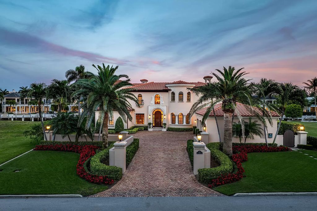 Discover unparalleled luxury at 336 E Coconut Palm Road in the prestigious Royal Palm Yacht & Country Club.