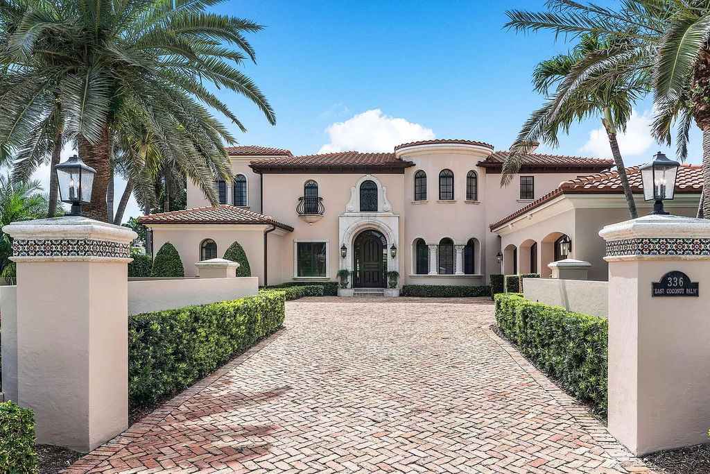 Discover unparalleled luxury at 336 E Coconut Palm Road in the prestigious Royal Palm Yacht & Country Club.