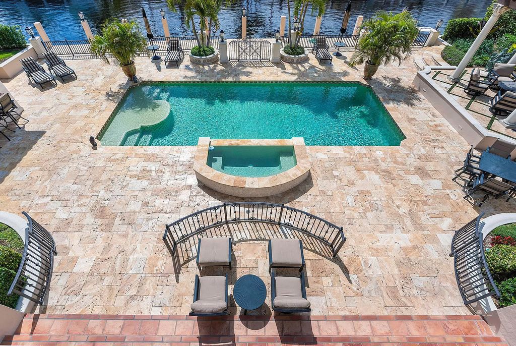 Discover unparalleled luxury at 336 E Coconut Palm Road in the prestigious Royal Palm Yacht & Country Club.