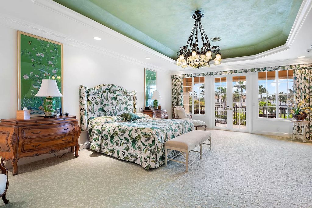 Discover unparalleled luxury at 336 E Coconut Palm Road in the prestigious Royal Palm Yacht & Country Club.