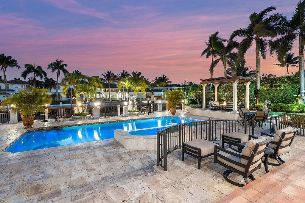 Discover unparalleled luxury at 336 E Coconut Palm Road in the prestigious Royal Palm Yacht & Country Club.