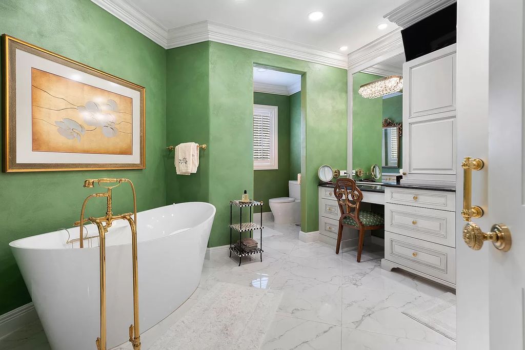 Discover unparalleled luxury at 336 E Coconut Palm Road in the prestigious Royal Palm Yacht & Country Club.