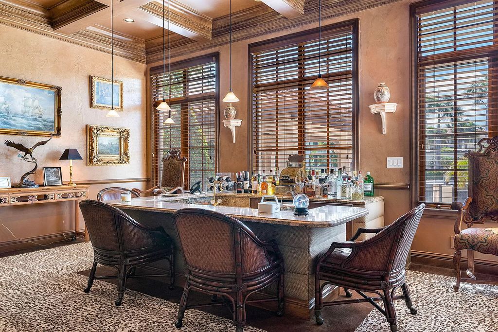 Discover unparalleled luxury at 336 E Coconut Palm Road in the prestigious Royal Palm Yacht & Country Club.