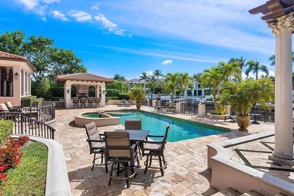 Discover unparalleled luxury at 336 E Coconut Palm Road in the prestigious Royal Palm Yacht & Country Club.