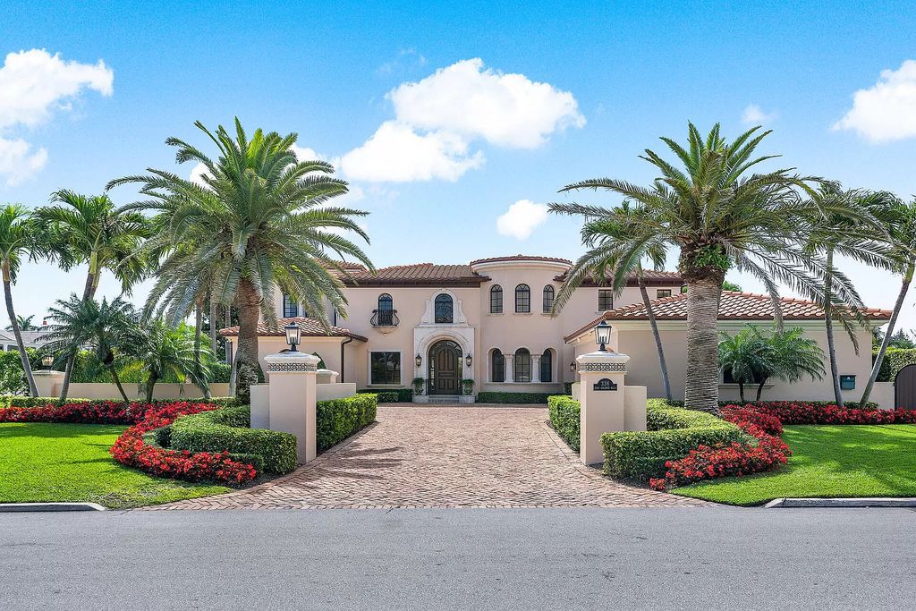 Discover unparalleled luxury at 336 E Coconut Palm Road in the prestigious Royal Palm Yacht & Country Club.