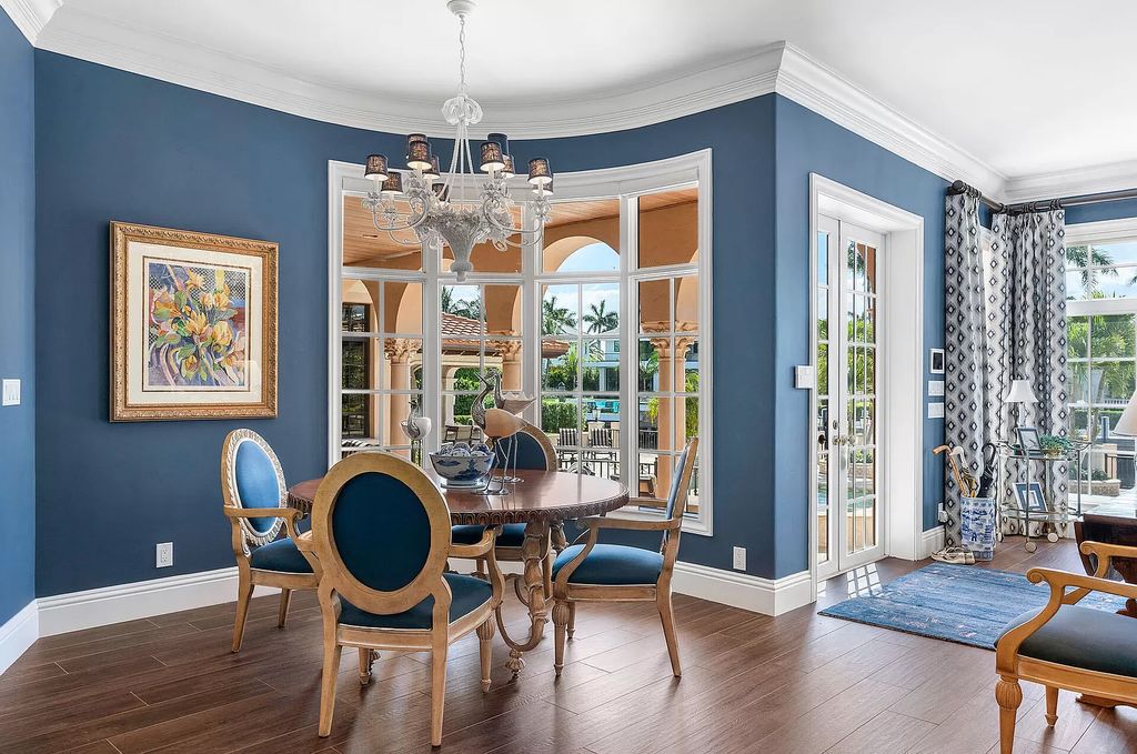 Discover unparalleled luxury at 336 E Coconut Palm Road in the prestigious Royal Palm Yacht & Country Club.