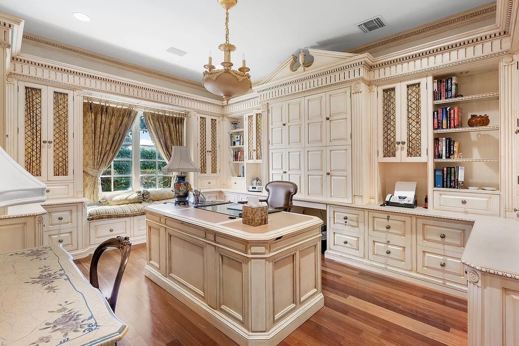 Discover unparalleled luxury at 336 E Coconut Palm Road in the prestigious Royal Palm Yacht & Country Club.
