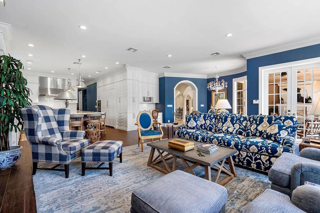 Discover unparalleled luxury at 336 E Coconut Palm Road in the prestigious Royal Palm Yacht & Country Club.