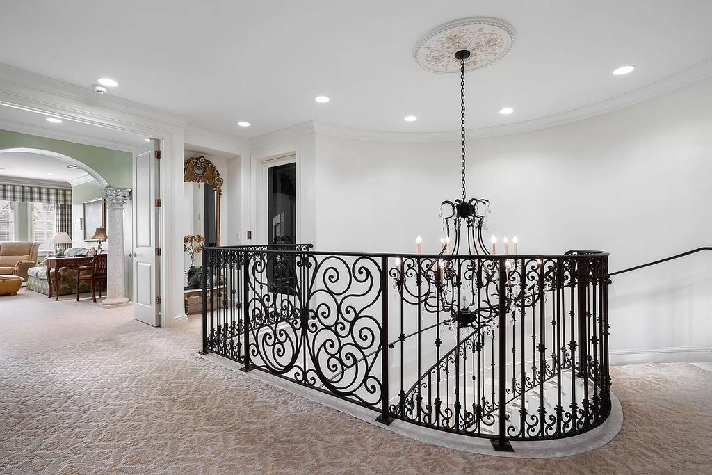 Discover unparalleled luxury at 336 E Coconut Palm Road in the prestigious Royal Palm Yacht & Country Club.