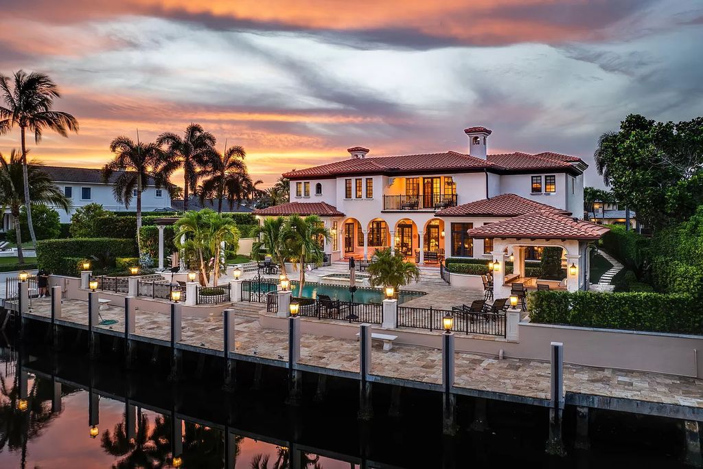 Discover unparalleled luxury at 336 E Coconut Palm Road in the prestigious Royal Palm Yacht & Country Club.