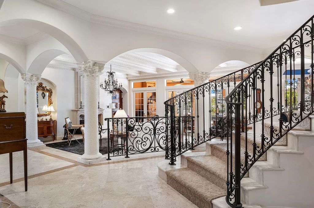 Discover unparalleled luxury at 336 E Coconut Palm Road in the prestigious Royal Palm Yacht & Country Club.