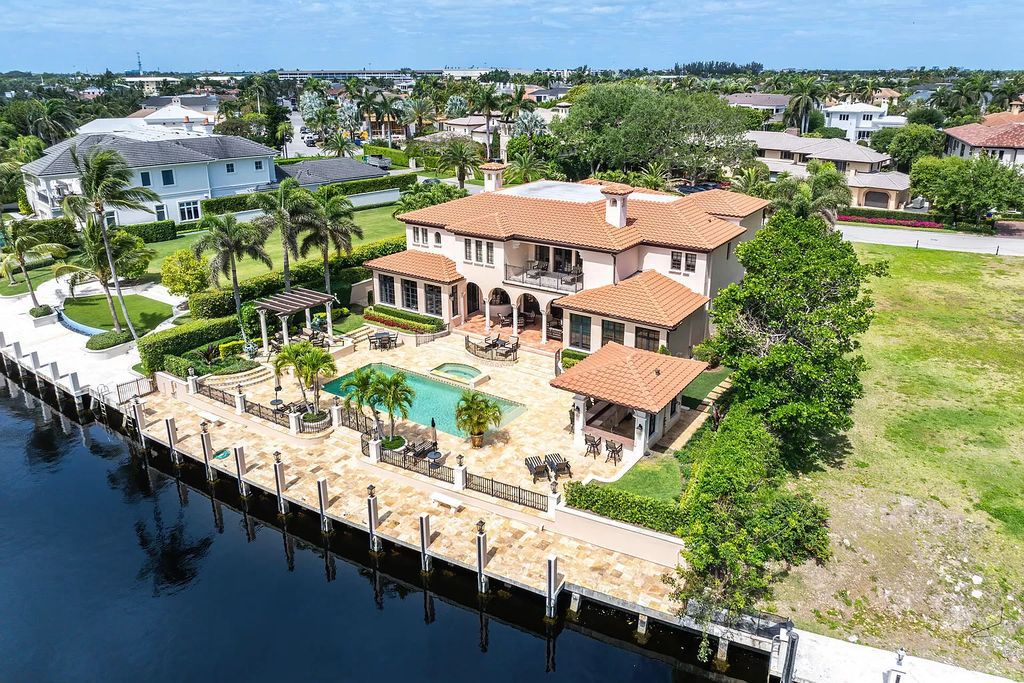Discover unparalleled luxury at 336 E Coconut Palm Road in the prestigious Royal Palm Yacht & Country Club.