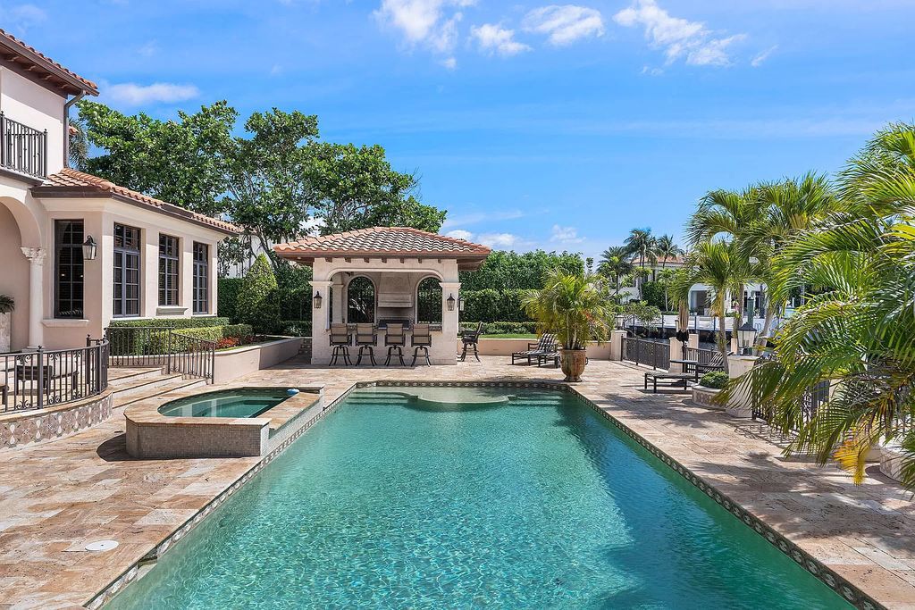 Discover unparalleled luxury at 336 E Coconut Palm Road in the prestigious Royal Palm Yacht & Country Club.