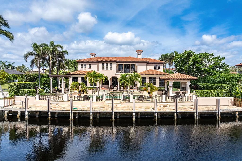 Discover unparalleled luxury at 336 E Coconut Palm Road in the prestigious Royal Palm Yacht & Country Club.