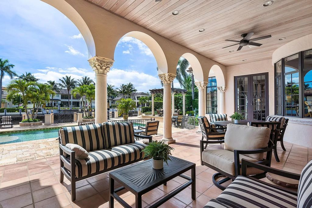 Discover unparalleled luxury at 336 E Coconut Palm Road in the prestigious Royal Palm Yacht & Country Club.