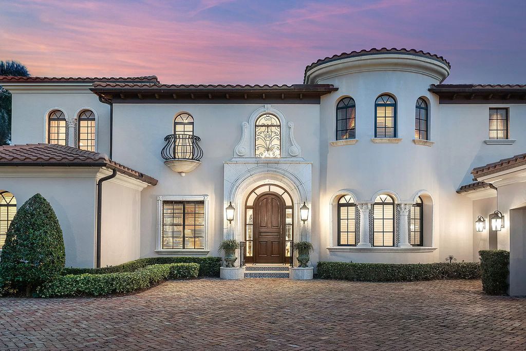 Discover unparalleled luxury at 336 E Coconut Palm Road in the prestigious Royal Palm Yacht & Country Club.