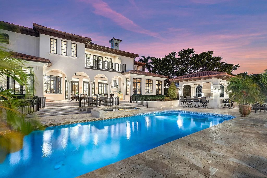 Discover unparalleled luxury at 336 E Coconut Palm Road in the prestigious Royal Palm Yacht & Country Club.