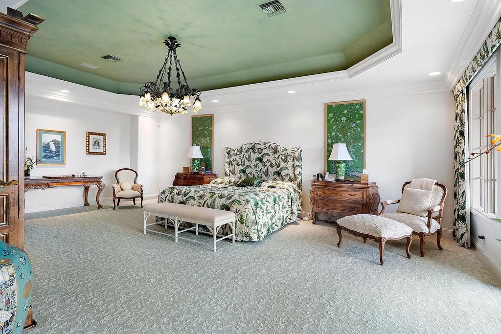 Discover unparalleled luxury at 336 E Coconut Palm Road in the prestigious Royal Palm Yacht & Country Club.