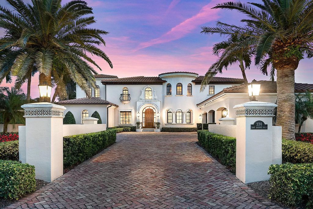 Discover unparalleled luxury at 336 E Coconut Palm Road in the prestigious Royal Palm Yacht & Country Club.