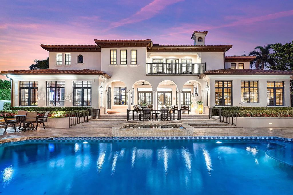 Discover unparalleled luxury at 336 E Coconut Palm Road in the prestigious Royal Palm Yacht & Country Club.