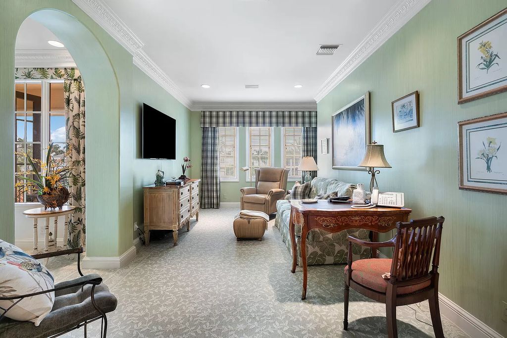 Discover unparalleled luxury at 336 E Coconut Palm Road in the prestigious Royal Palm Yacht & Country Club.