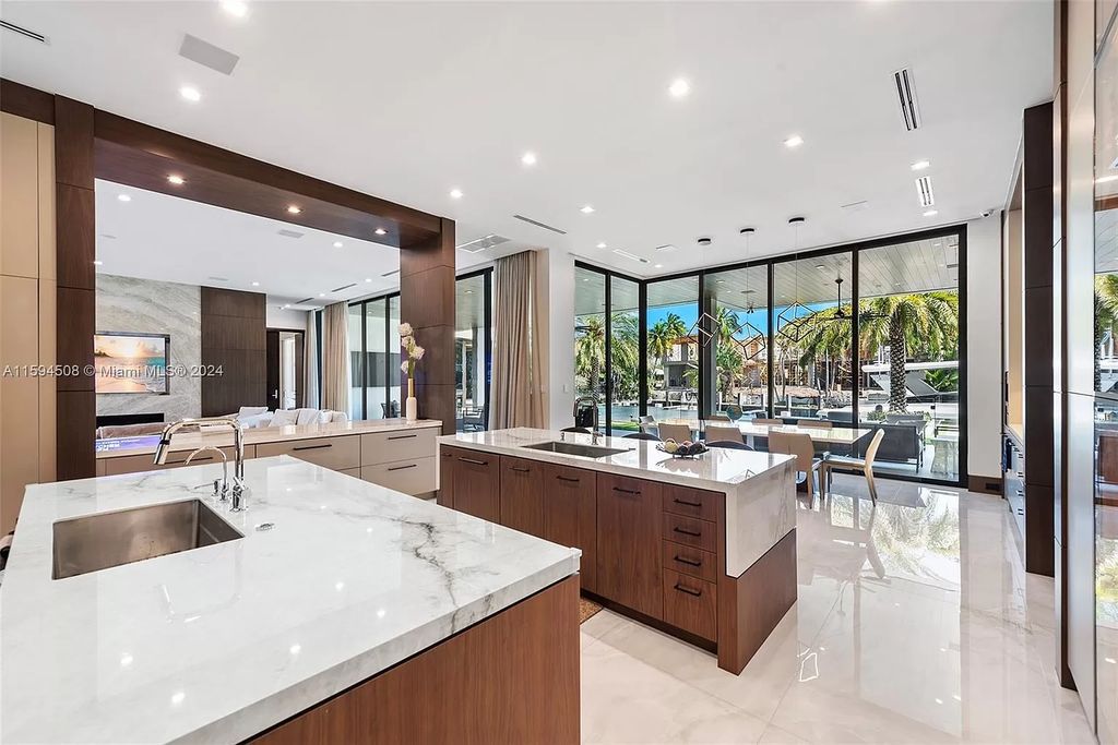 Welcome to 298 W Key Palm Rd, a spectacular newly built waterfront estate by SRD Building Corp. Located in Boca Raton's prestigious Royal Palm Yacht & Country Club, this luxurious home offers over 11,471 square feet of living space on a 26,728 square feet lot.