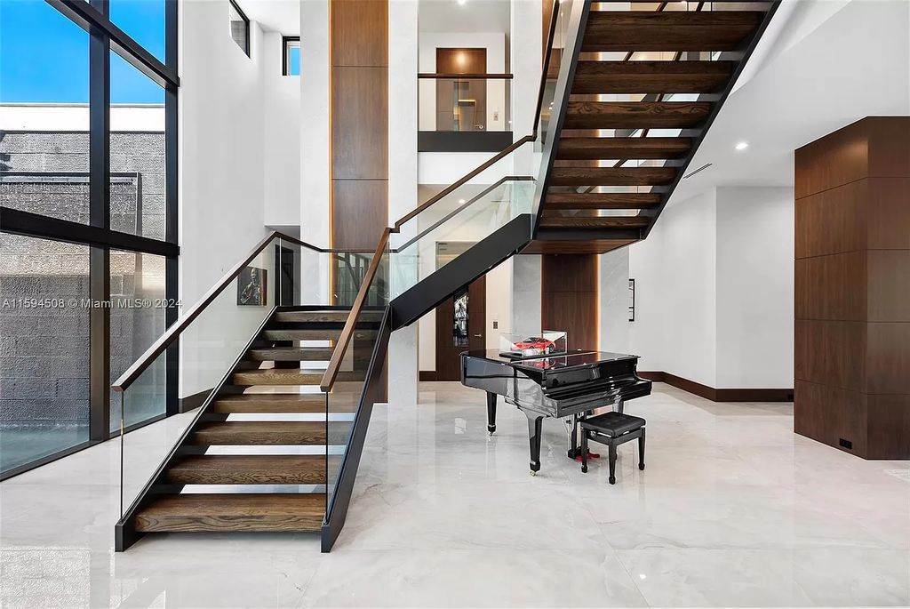 Welcome to 298 W Key Palm Rd, a spectacular newly built waterfront estate by SRD Building Corp. Located in Boca Raton's prestigious Royal Palm Yacht & Country Club, this luxurious home offers over 11,471 square feet of living space on a 26,728 square feet lot.