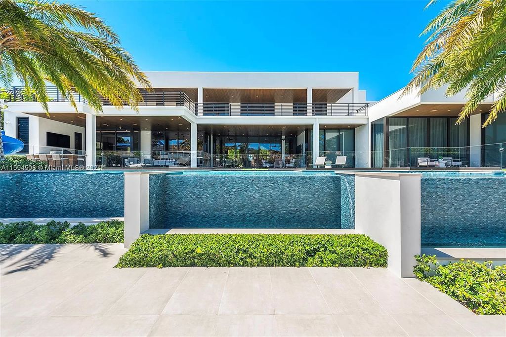 Welcome to 298 W Key Palm Rd, a spectacular newly built waterfront estate by SRD Building Corp. Located in Boca Raton's prestigious Royal Palm Yacht & Country Club, this luxurious home offers over 11,471 square feet of living space on a 26,728 square feet lot.