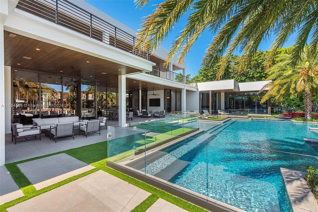 Welcome to 298 W Key Palm Rd, a spectacular newly built waterfront estate by SRD Building Corp. Located in Boca Raton's prestigious Royal Palm Yacht & Country Club, this luxurious home offers over 11,471 square feet of living space on a 26,728 square feet lot.