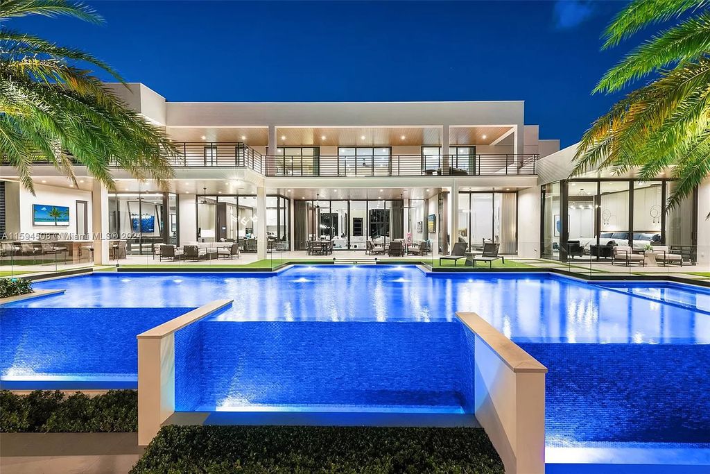 Welcome to 298 W Key Palm Rd, a spectacular newly built waterfront estate by SRD Building Corp. Located in Boca Raton's prestigious Royal Palm Yacht & Country Club, this luxurious home offers over 11,471 square feet of living space on a 26,728 square feet lot.