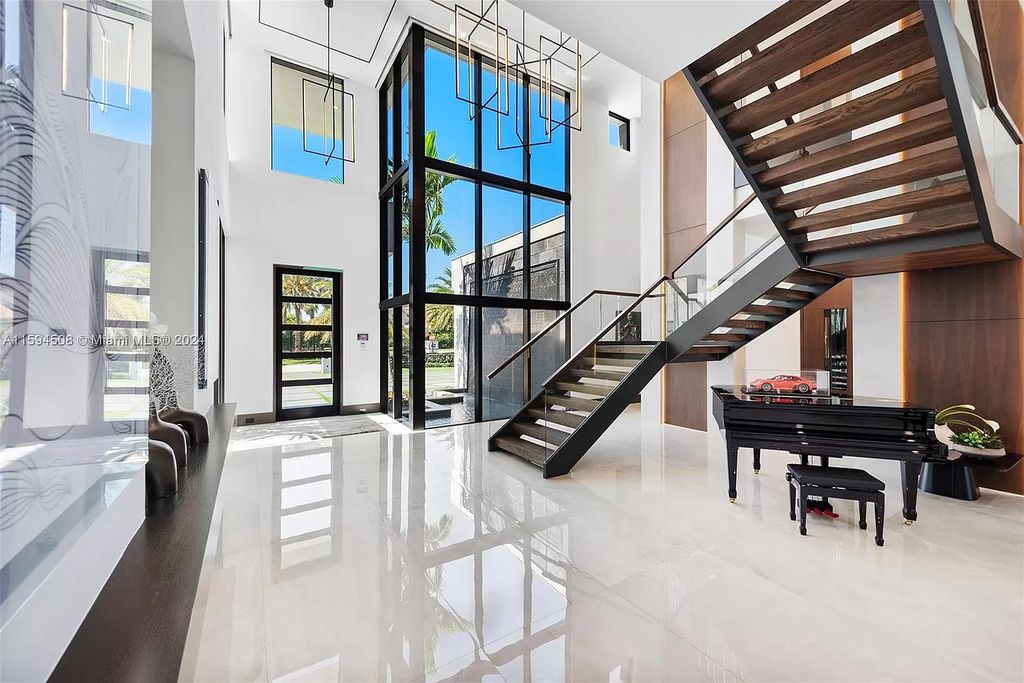 Welcome to 298 W Key Palm Rd, a spectacular newly built waterfront estate by SRD Building Corp. Located in Boca Raton's prestigious Royal Palm Yacht & Country Club, this luxurious home offers over 11,471 square feet of living space on a 26,728 square feet lot.