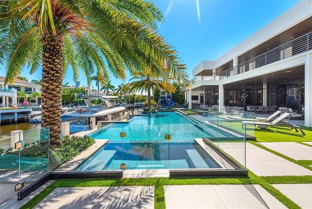 Welcome to 298 W Key Palm Rd, a spectacular newly built waterfront estate by SRD Building Corp. Located in Boca Raton's prestigious Royal Palm Yacht & Country Club, this luxurious home offers over 11,471 square feet of living space on a 26,728 square feet lot.