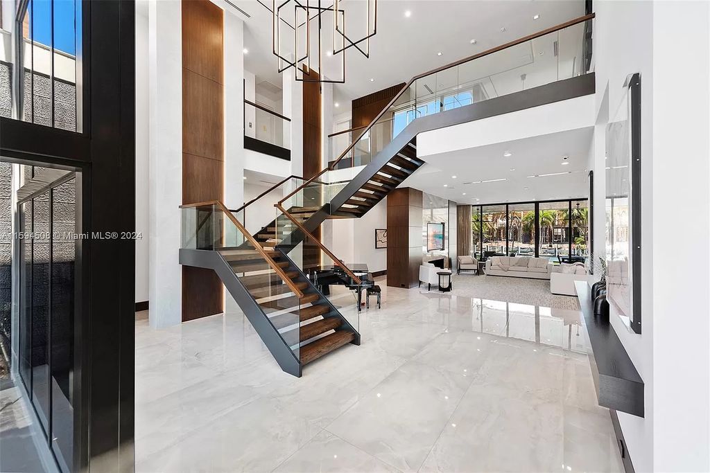 Welcome to 298 W Key Palm Rd, a spectacular newly built waterfront estate by SRD Building Corp. Located in Boca Raton's prestigious Royal Palm Yacht & Country Club, this luxurious home offers over 11,471 square feet of living space on a 26,728 square feet lot.