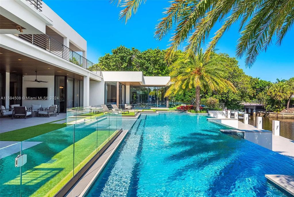 Welcome to 298 W Key Palm Rd, a spectacular newly built waterfront estate by SRD Building Corp. Located in Boca Raton's prestigious Royal Palm Yacht & Country Club, this luxurious home offers over 11,471 square feet of living space on a 26,728 square feet lot.