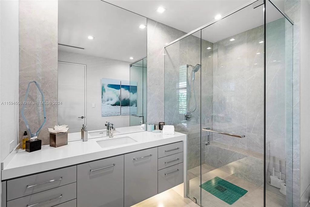 Welcome to 298 W Key Palm Rd, a spectacular newly built waterfront estate by SRD Building Corp. Located in Boca Raton's prestigious Royal Palm Yacht & Country Club, this luxurious home offers over 11,471 square feet of living space on a 26,728 square feet lot.