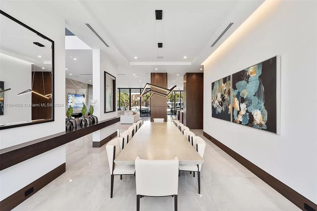 Welcome to 298 W Key Palm Rd, a spectacular newly built waterfront estate by SRD Building Corp. Located in Boca Raton's prestigious Royal Palm Yacht & Country Club, this luxurious home offers over 11,471 square feet of living space on a 26,728 square feet lot.