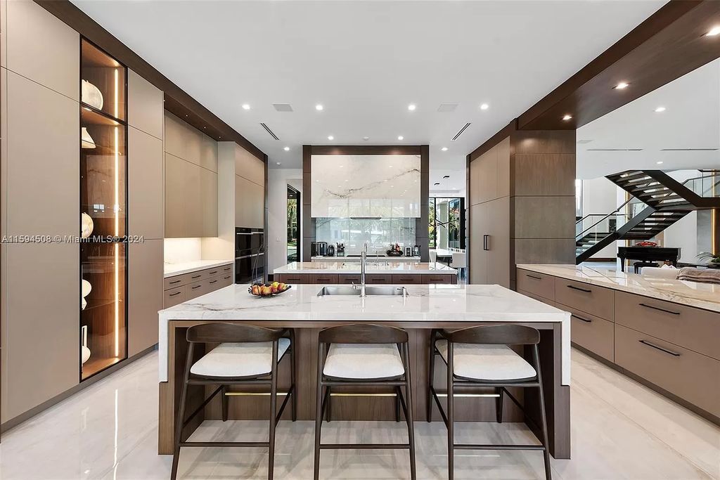 Welcome to 298 W Key Palm Rd, a spectacular newly built waterfront estate by SRD Building Corp. Located in Boca Raton's prestigious Royal Palm Yacht & Country Club, this luxurious home offers over 11,471 square feet of living space on a 26,728 square feet lot.