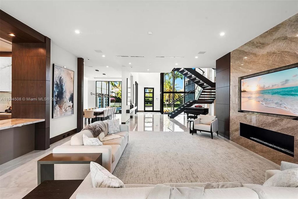 Welcome to 298 W Key Palm Rd, a spectacular newly built waterfront estate by SRD Building Corp. Located in Boca Raton's prestigious Royal Palm Yacht & Country Club, this luxurious home offers over 11,471 square feet of living space on a 26,728 square feet lot.
