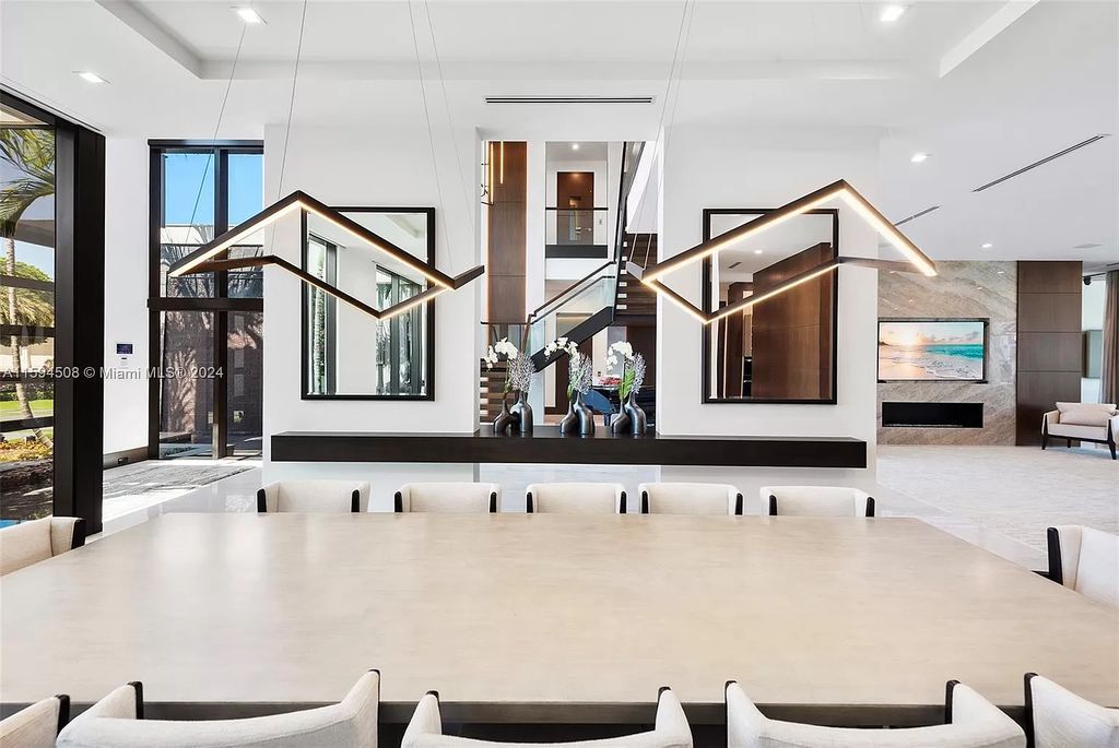 Welcome to 298 W Key Palm Rd, a spectacular newly built waterfront estate by SRD Building Corp. Located in Boca Raton's prestigious Royal Palm Yacht & Country Club, this luxurious home offers over 11,471 square feet of living space on a 26,728 square feet lot.
