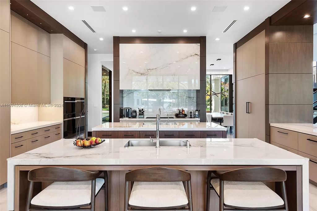 Welcome to 298 W Key Palm Rd, a spectacular newly built waterfront estate by SRD Building Corp. Located in Boca Raton's prestigious Royal Palm Yacht & Country Club, this luxurious home offers over 11,471 square feet of living space on a 26,728 square feet lot.